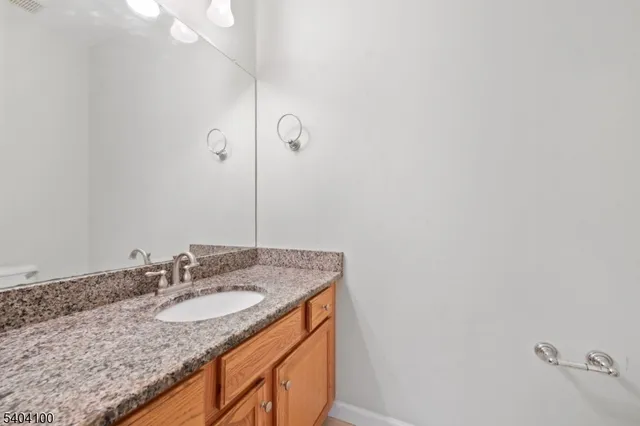 a view of a room with wooden floor and windows