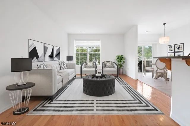 a view of a room with wooden floor and windows
