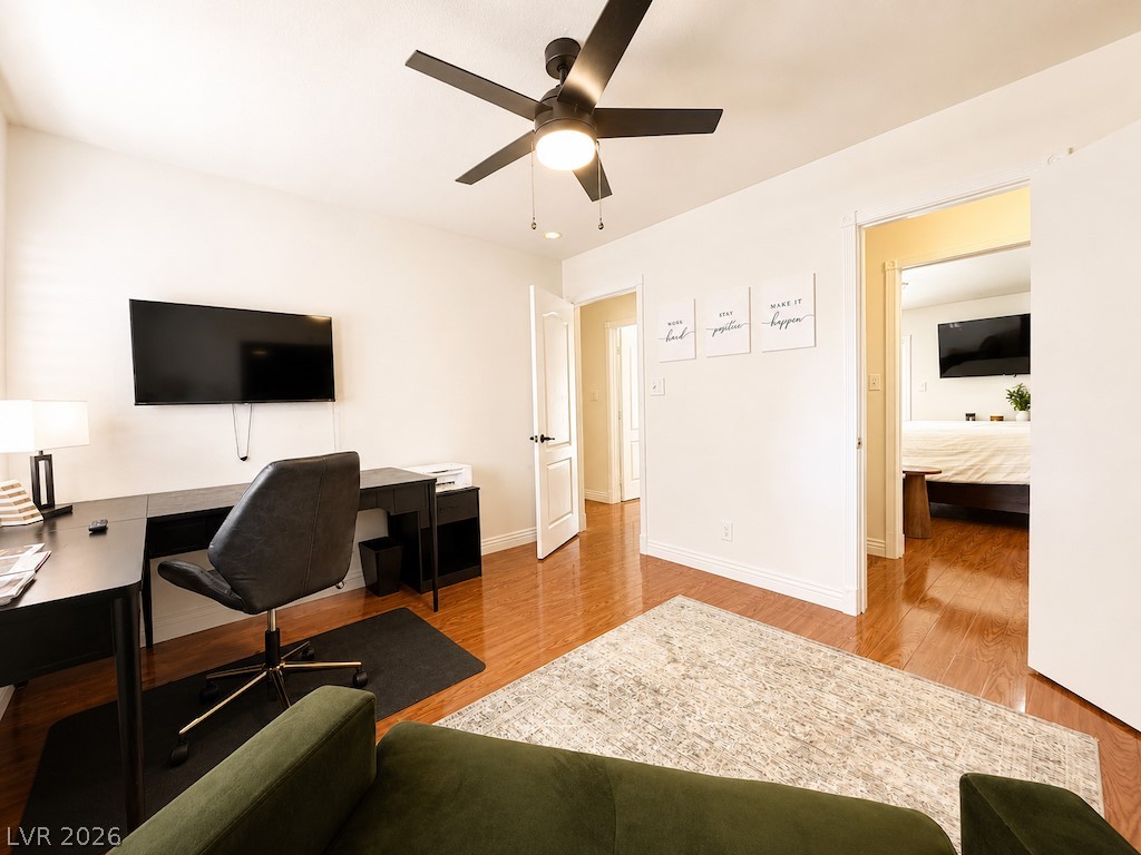 3010 East Viking Road Las Vegas, NV 89121 - Photo 20 of 48 An inviting room boasts rich hardwood flooring and a functional workspace.