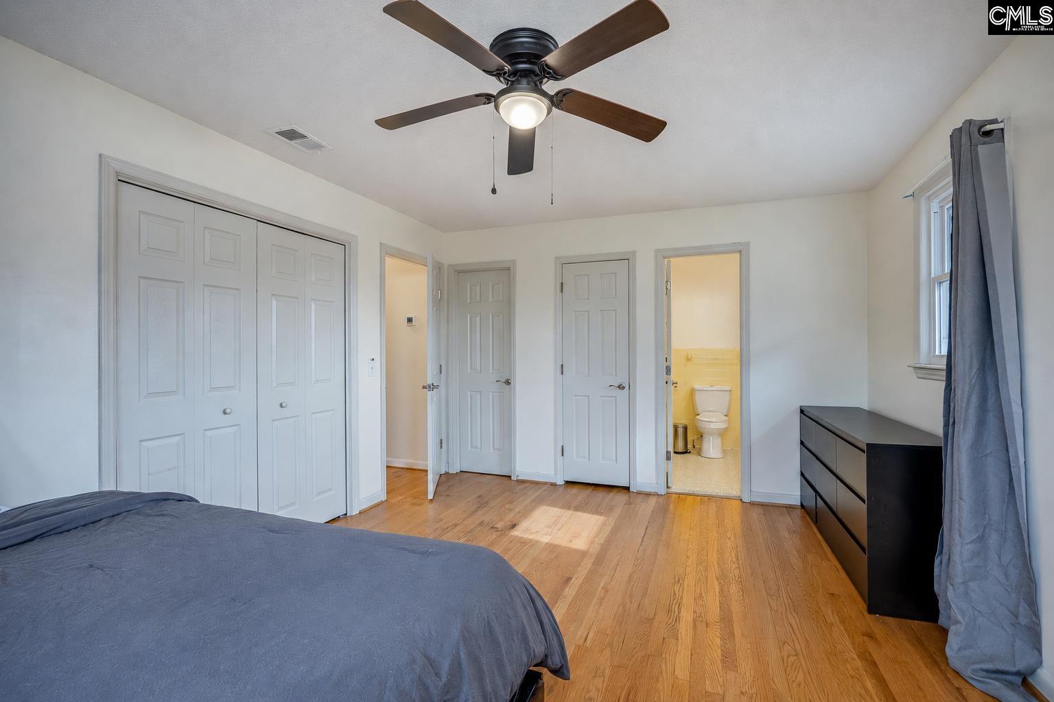 560 Edisto Street Batesburg, SC 29006 - Photo 23 of 49 a bedroom with a bed and a ceiling fan