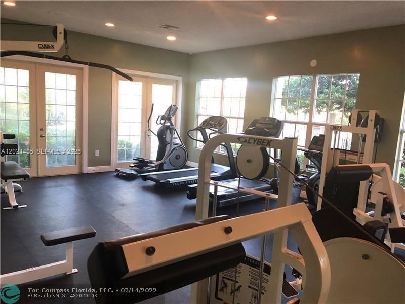 3870 Lyons Road, Unit 2098 Pompano Beach, FL 33073 - Photo 9 of 31 a view of a room with gym equipment