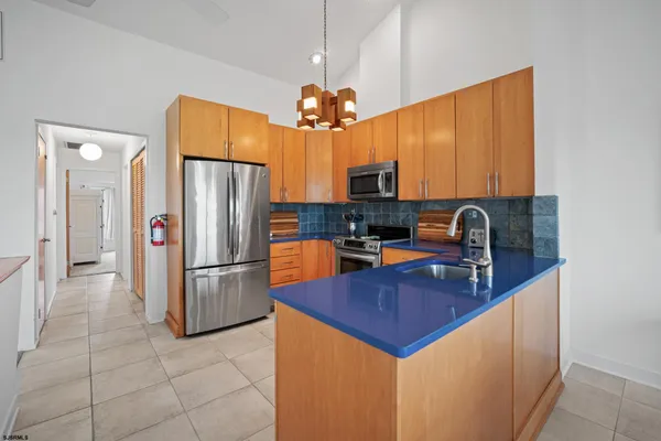 a kitchen with refrigerator cabinets and a counter top space