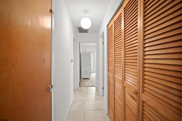 a view of a bathroom from a hallway