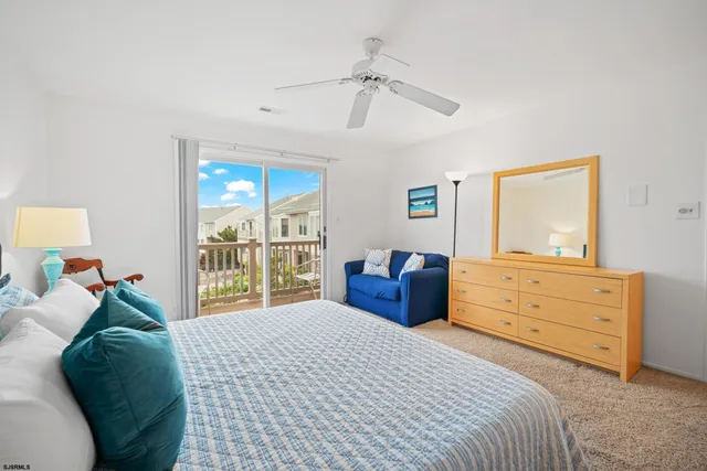 a bedroom with a bed dresser and a window