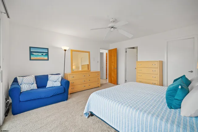 a bedroom with a bed couch and window