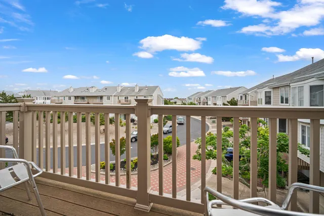 a view of a street from a balcony