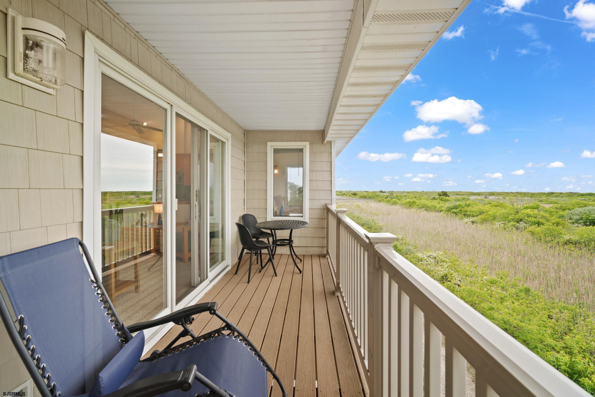 45 Coquille, Unit 45 Brigantine, NJ 08203 - Photo 9 of 30 a view of a balcony with chair and table