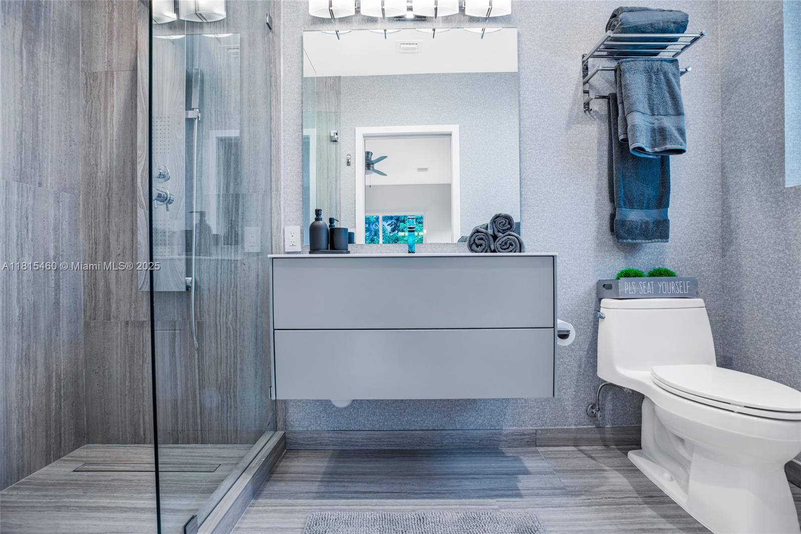 38 Southwest 25th Road Miami, FL 33129 - Photo 20 of 29 a bathroom with a toilet and a shower