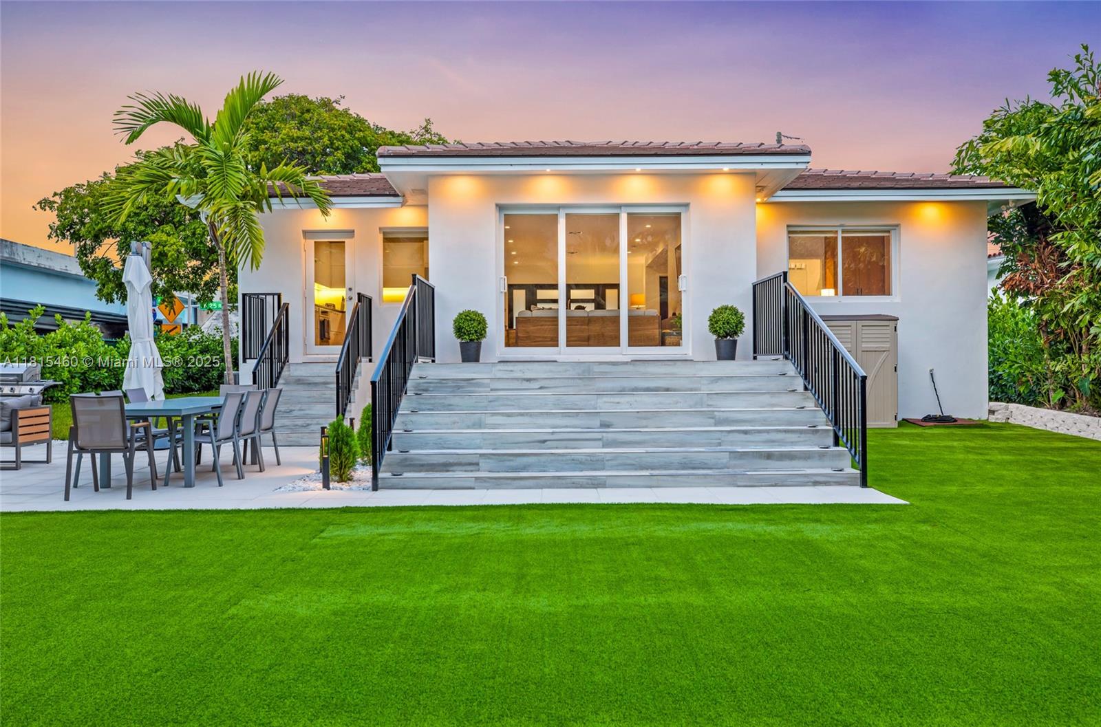 38 Southwest 25th Road Miami, FL 33129 - Photo 2 of 29 a front view of house with a garden and patio