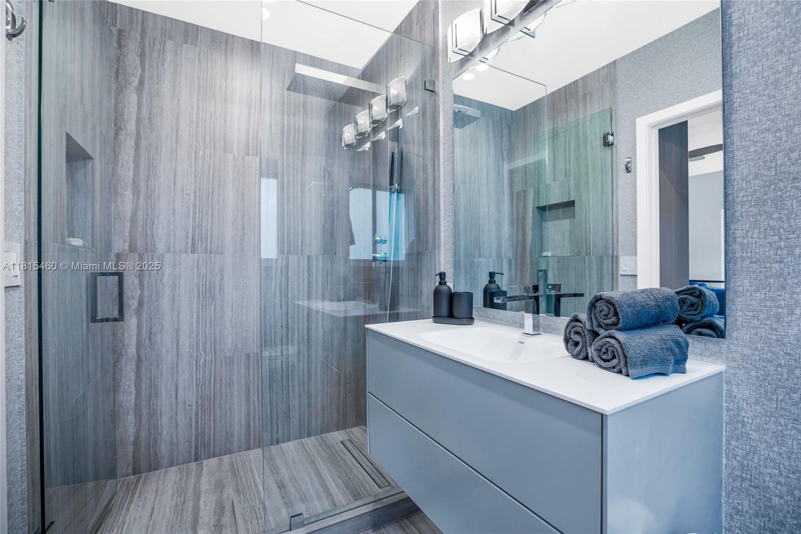 38 Southwest 25th Road Miami, FL 33129 - Photo 21 of 29 a bathroom with a sink a vanity and a mirror