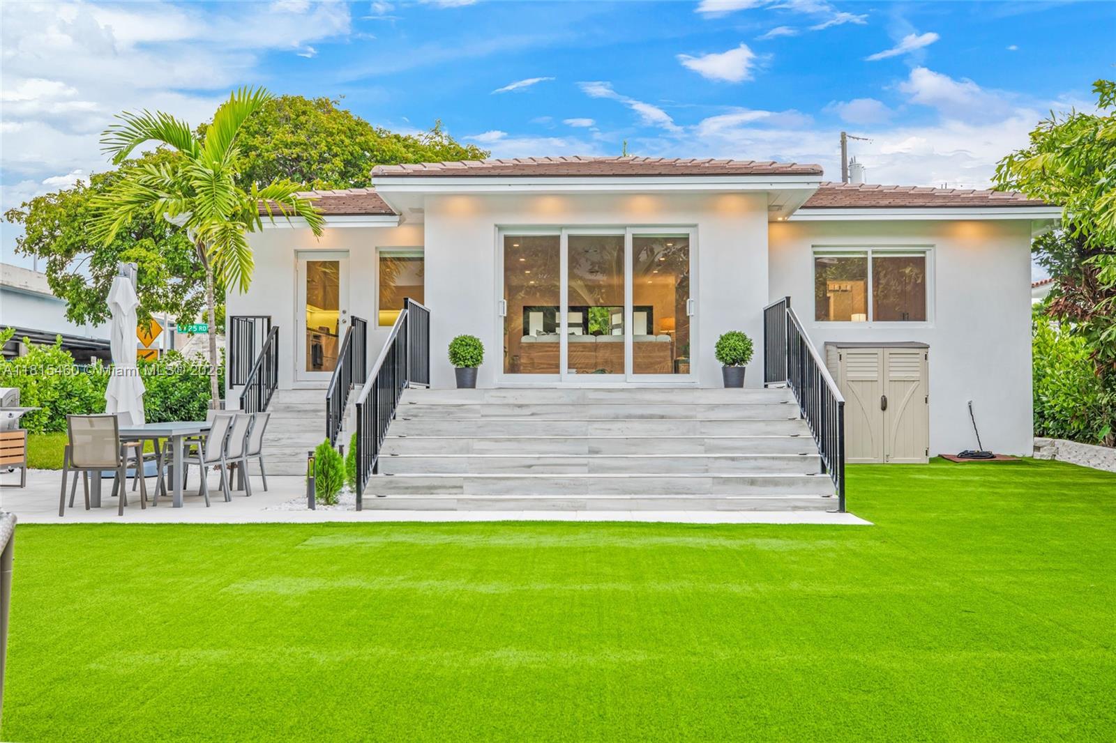 38 Southwest 25th Road Miami, FL 33129 - Photo 25 of 29 a front view of a house with a yard