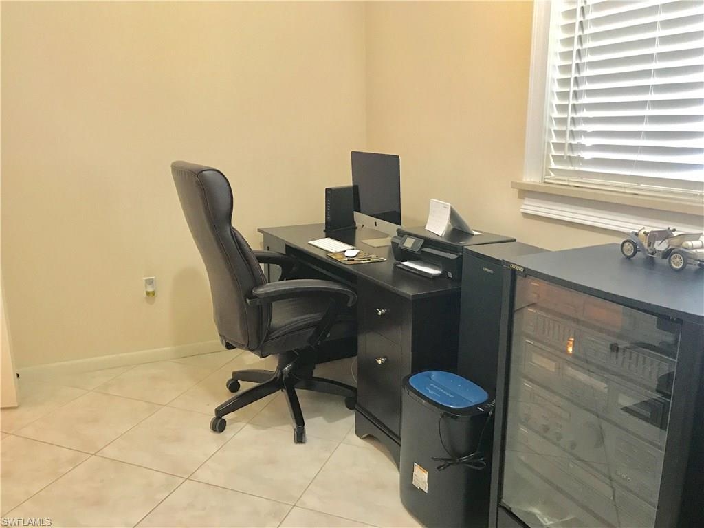 4256 31st Place Southwest Naples, FL 34116 - Photo 16 of 20 a view of a workspace with furniture