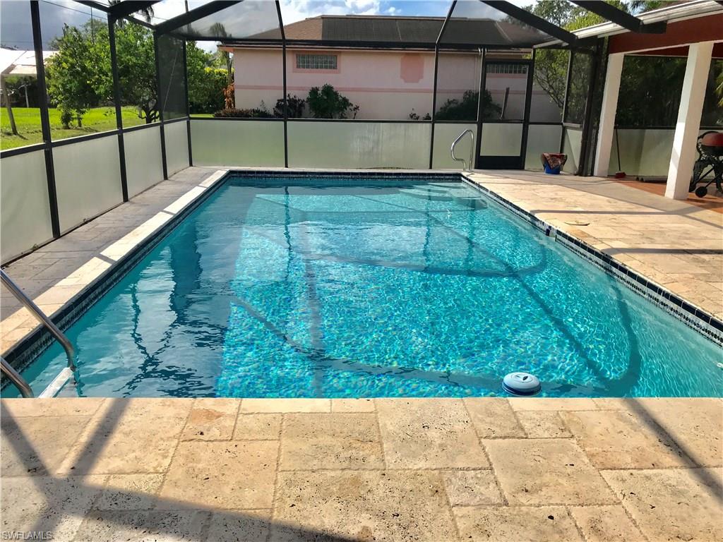 4256 31st Place Southwest Naples, FL 34116 - Photo 19 of 20 a view of a backyard