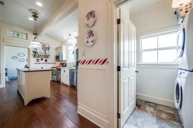 a utility room with cabinets a washer and dryer