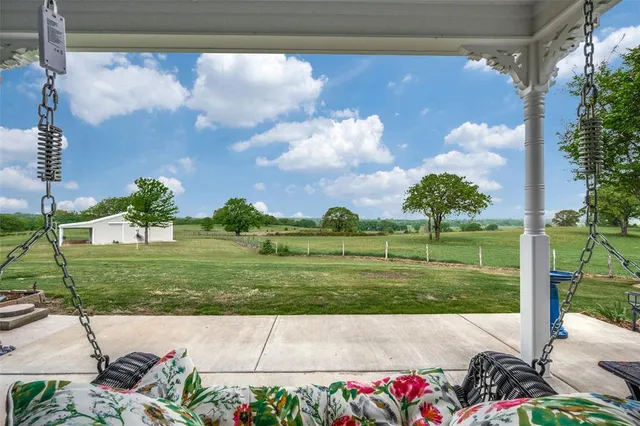 a view of a bench in front of a yard