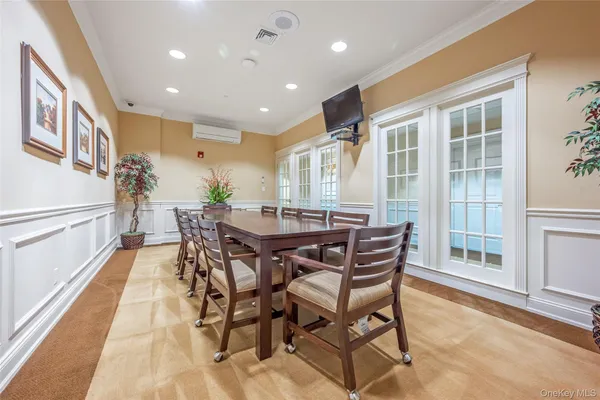 a dining room with furniture and window