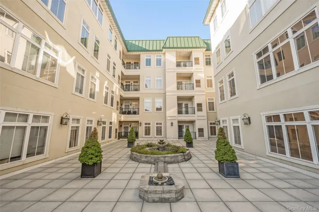 a front view of a building with glass windows