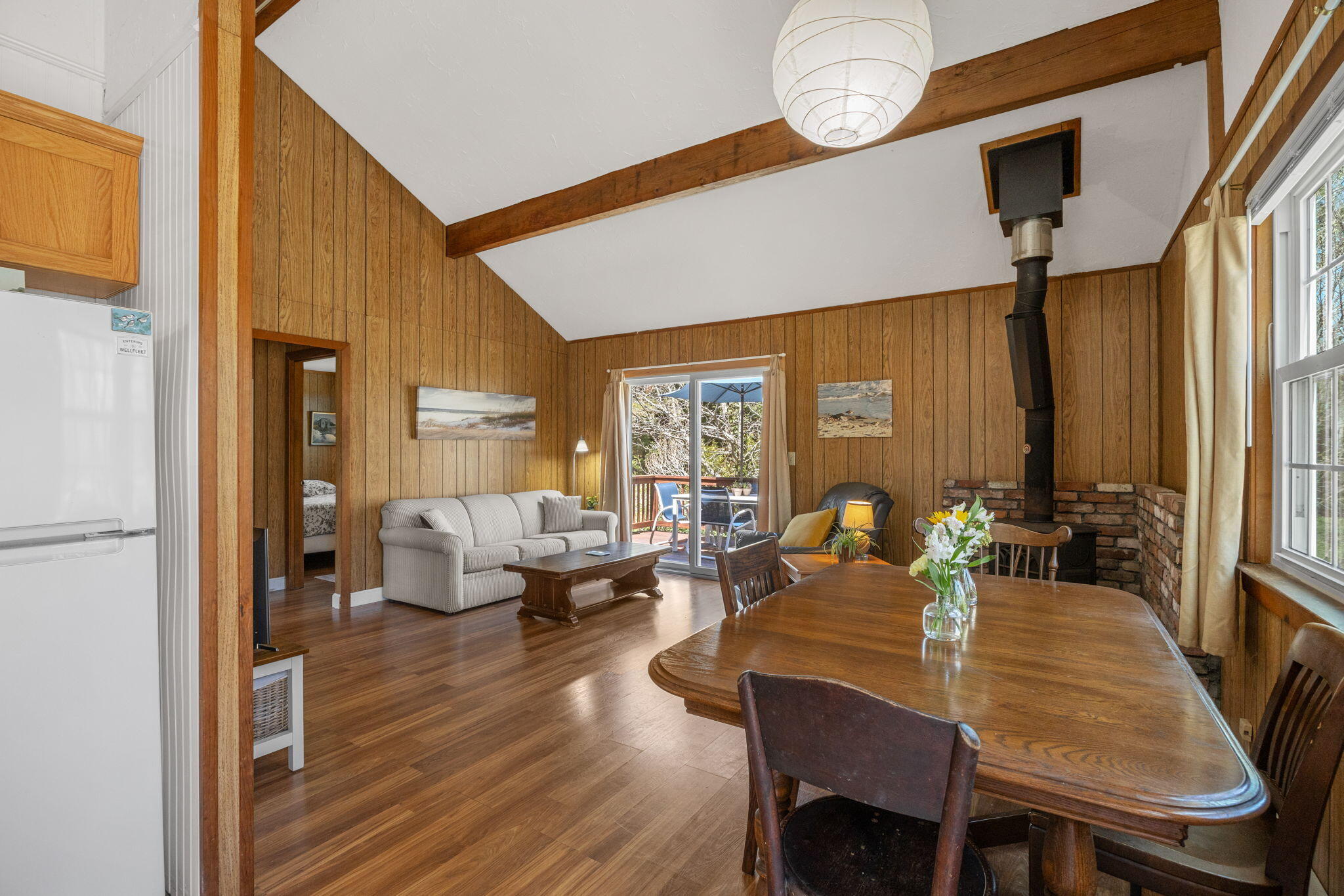 60 Long Avenue, Unit A Wellfleet, MA 02667 - Photo 4 of 28 a view of a dining room with furniture window and wooden floor
