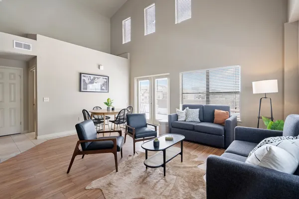 a living room with furniture and a large window