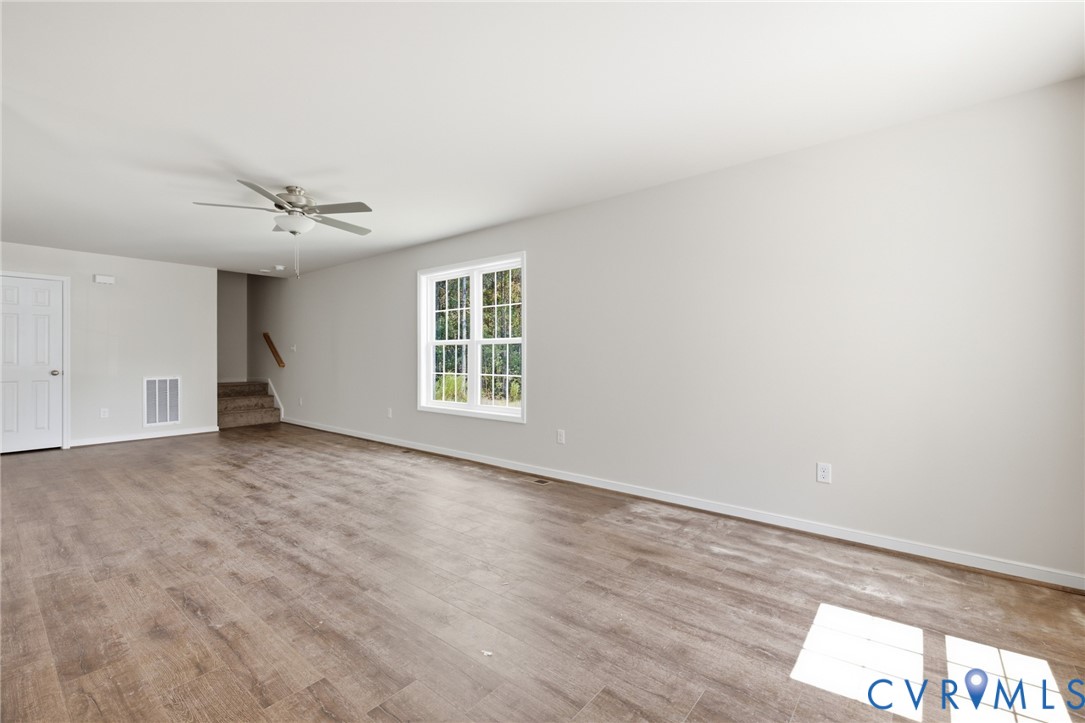 8440 Railroad Bed Road Carson, VA 23830 - Photo 27 of 39 Spacious room featuring wood-finish flooring, a ce