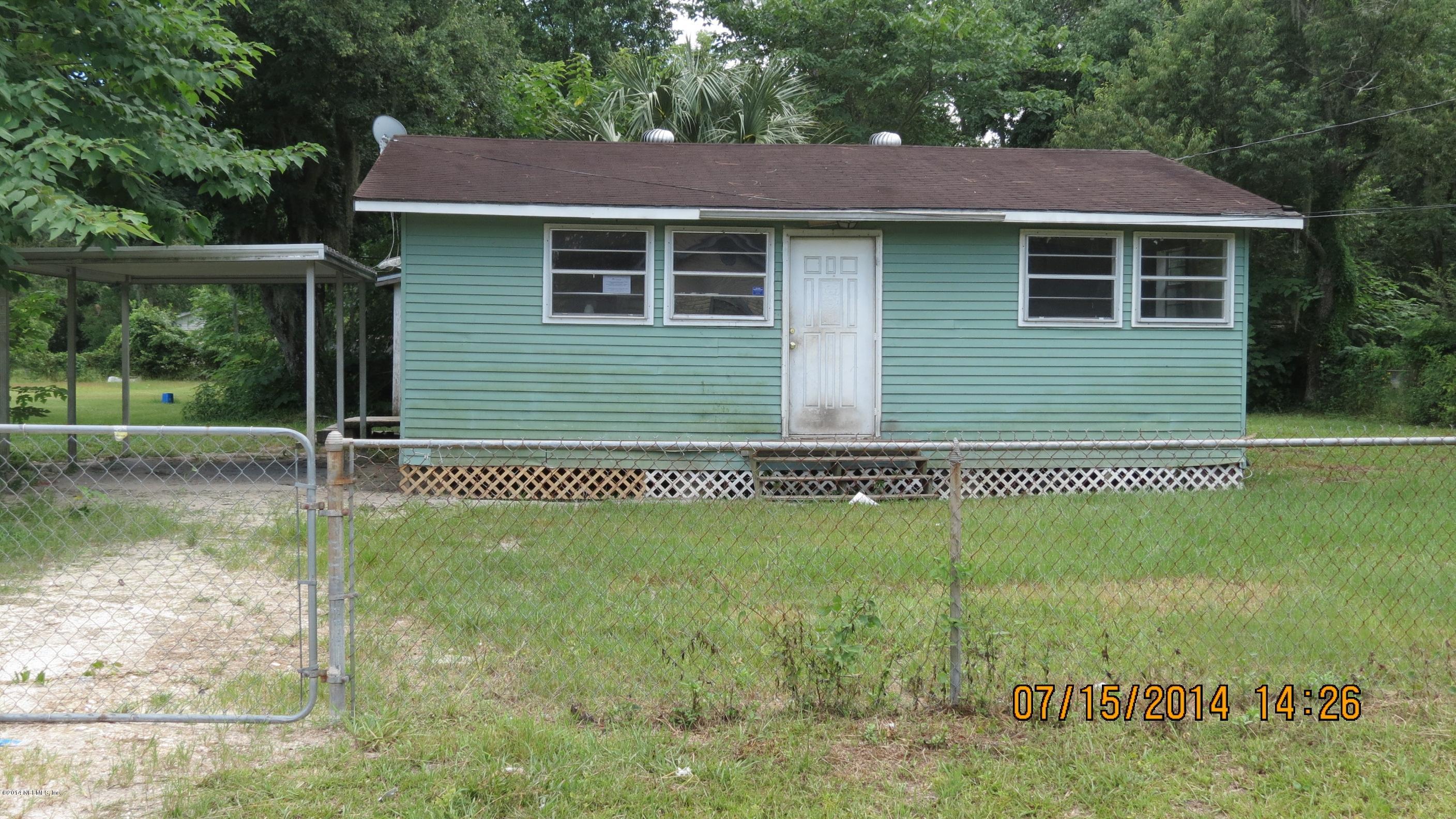 1144 Fields Road Jacksonville, FL 32218 - Photo 1 of 5 a view of a house with a yard