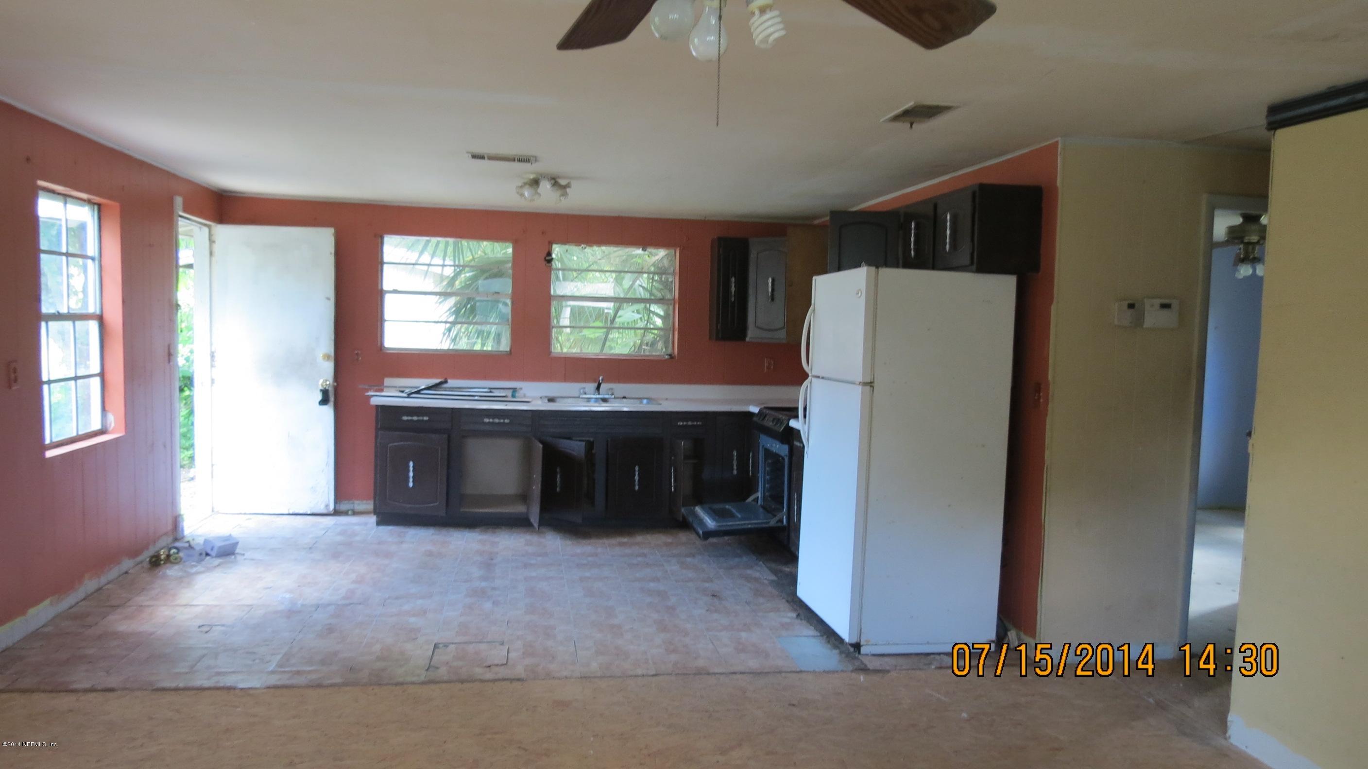 1144 Fields Road Jacksonville, FL 32218 - Photo 3 of 5 a kitchen with refrigerator a stove and a window