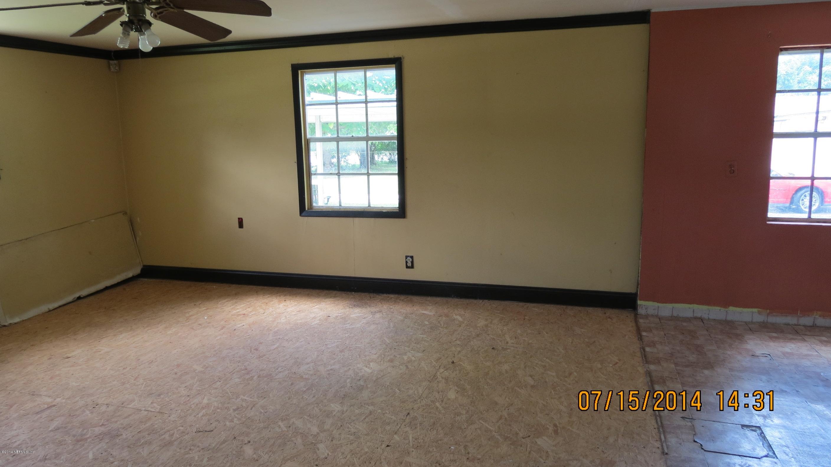 1144 Fields Road Jacksonville, FL 32218 - Photo 5 of 5 an empty room with a window