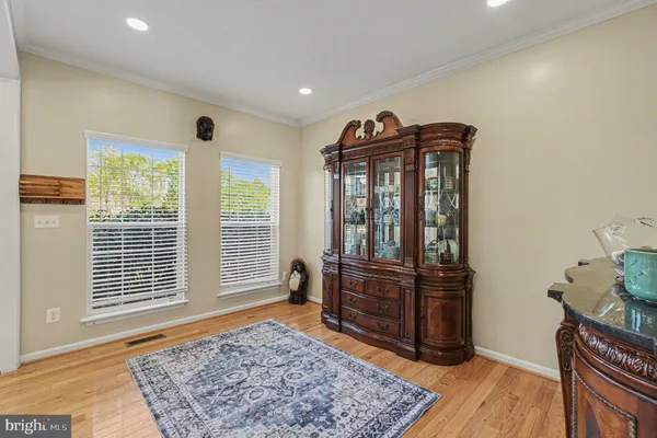 a view of a livingroom with wooden floor and a couch