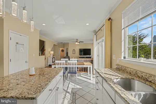 a kitchen with a sink and a refrigerator