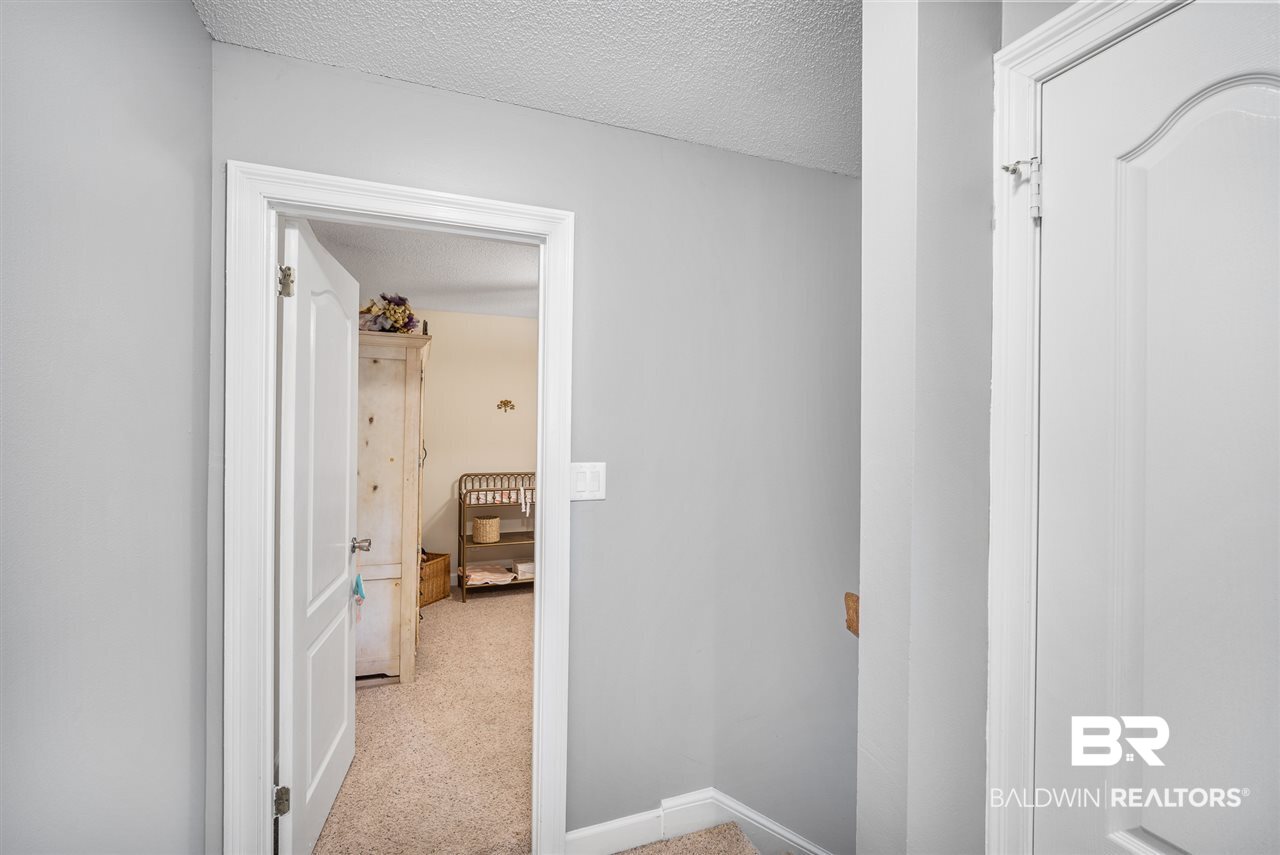 596 Ridgewood Drive Daphne, AL 36526 - Photo 21 of 29 Hallway Upstairs