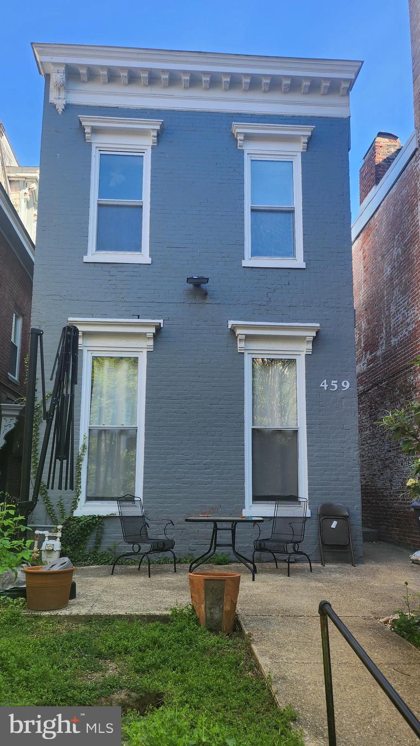 459 M Street Northwest, Unit C Washington, DC 20001 - Photo 1 of 8 a front view of a house with garden