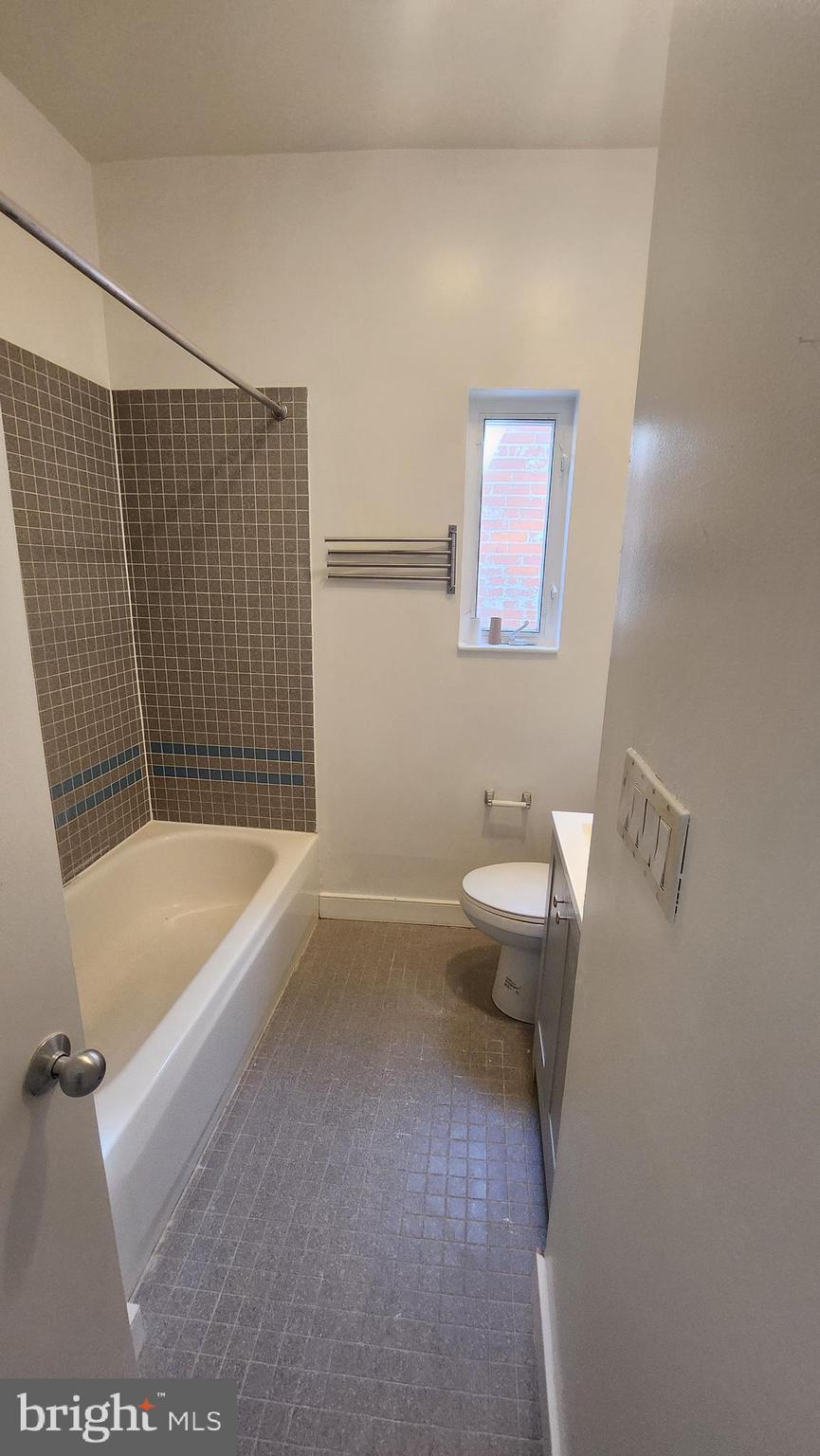 459 M Street Northwest, Unit C Washington, DC 20001 - Photo 3 of 8 a bathroom with a toilet a sink and bathtub