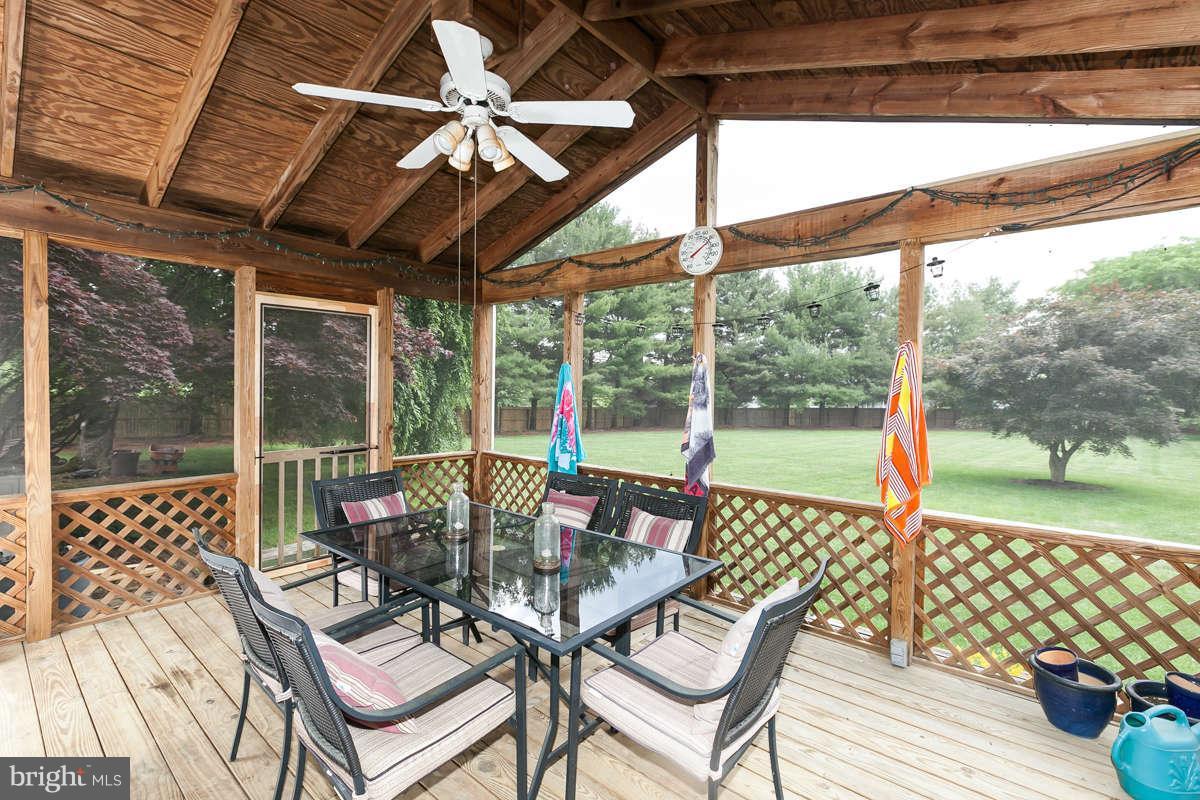 1769 Florence Road Mount Airy, MD 21771 - Photo 25 of 30 a roof deck with table and chairs and wooden floor