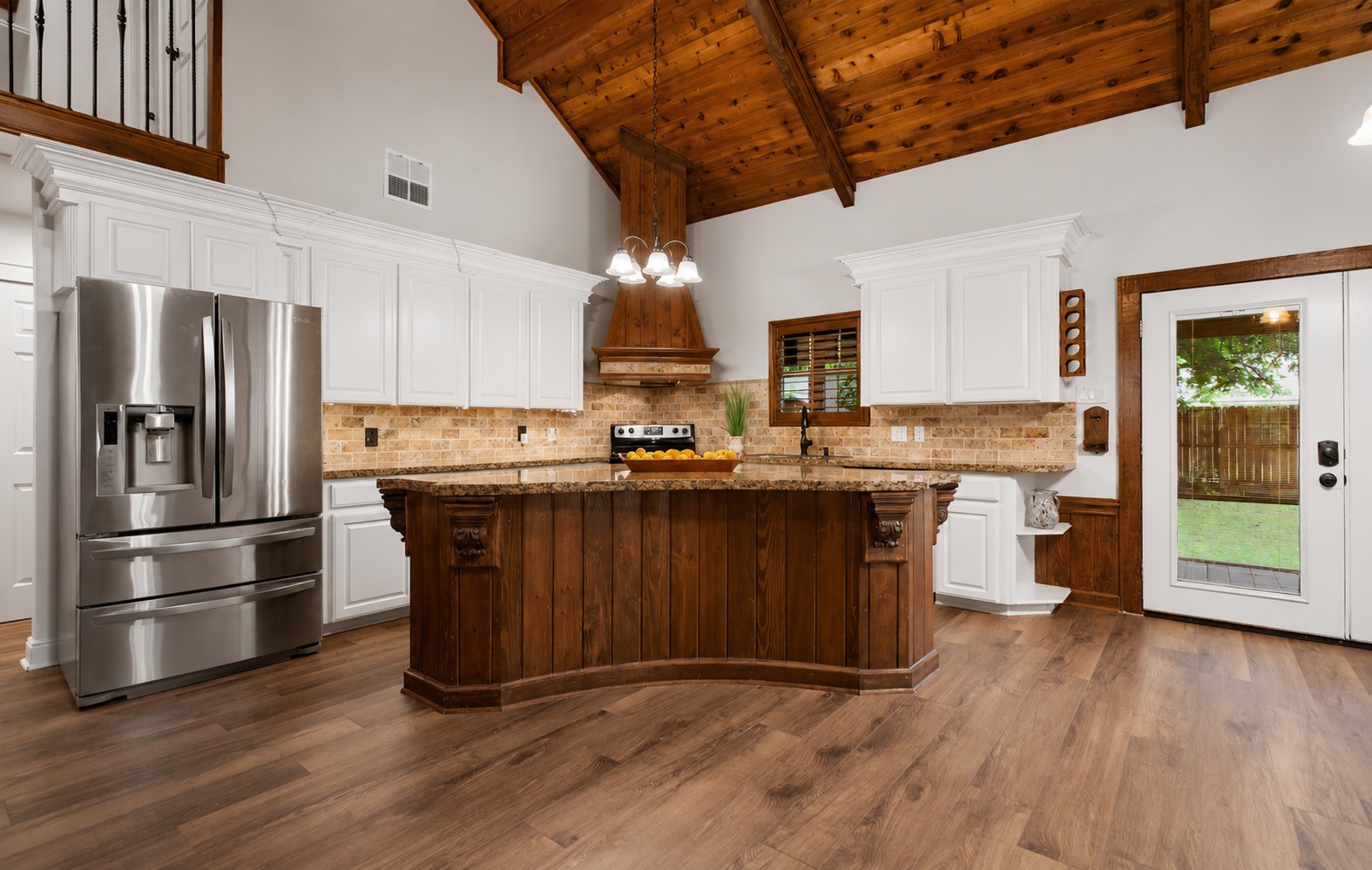312 Springwood Drive Conroe, TX 77385 - Photo 15 of 50 Well-appointed kitchen with a large center island, abundant counter space, and ample cabinetry.