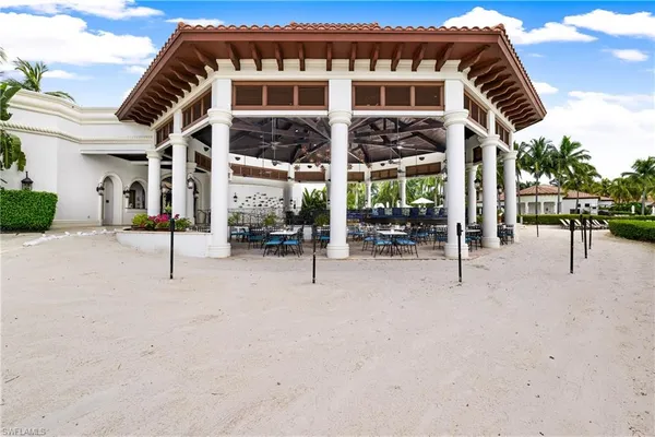 a view of a swimming pool with outdoor seating