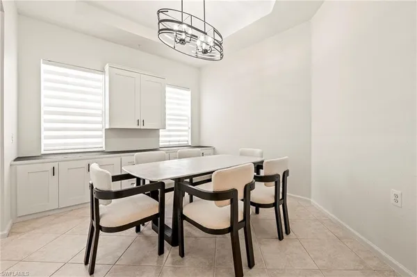 a view of a dining room with furniture and window