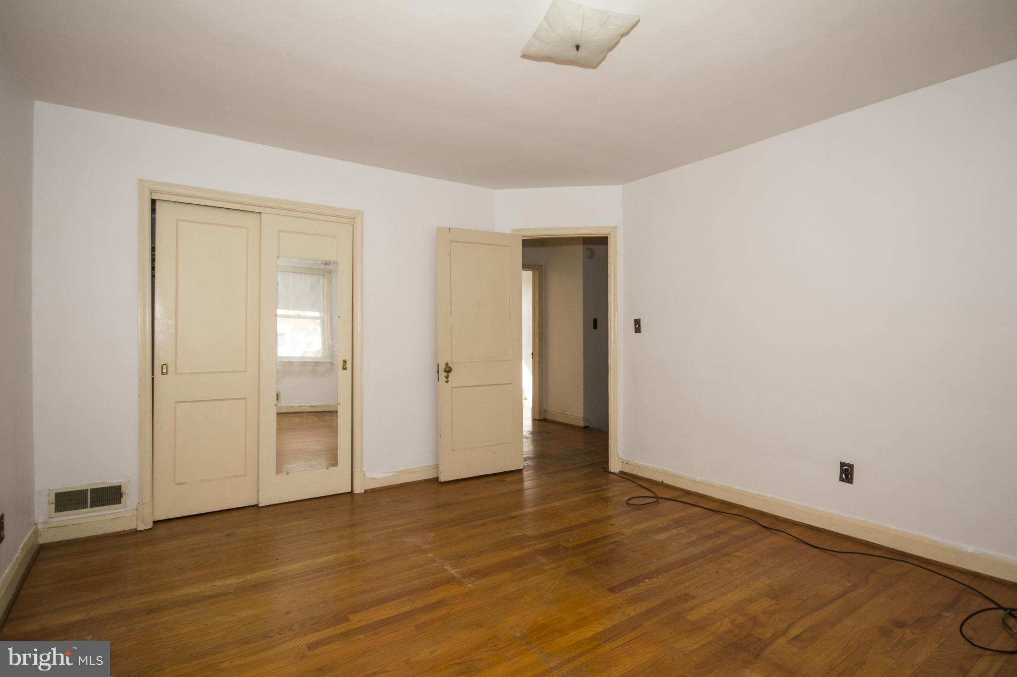 1673 Northbourne Road Baltimore, MD 21239 - Photo 12 of 21 a view of an empty room and wooden floor