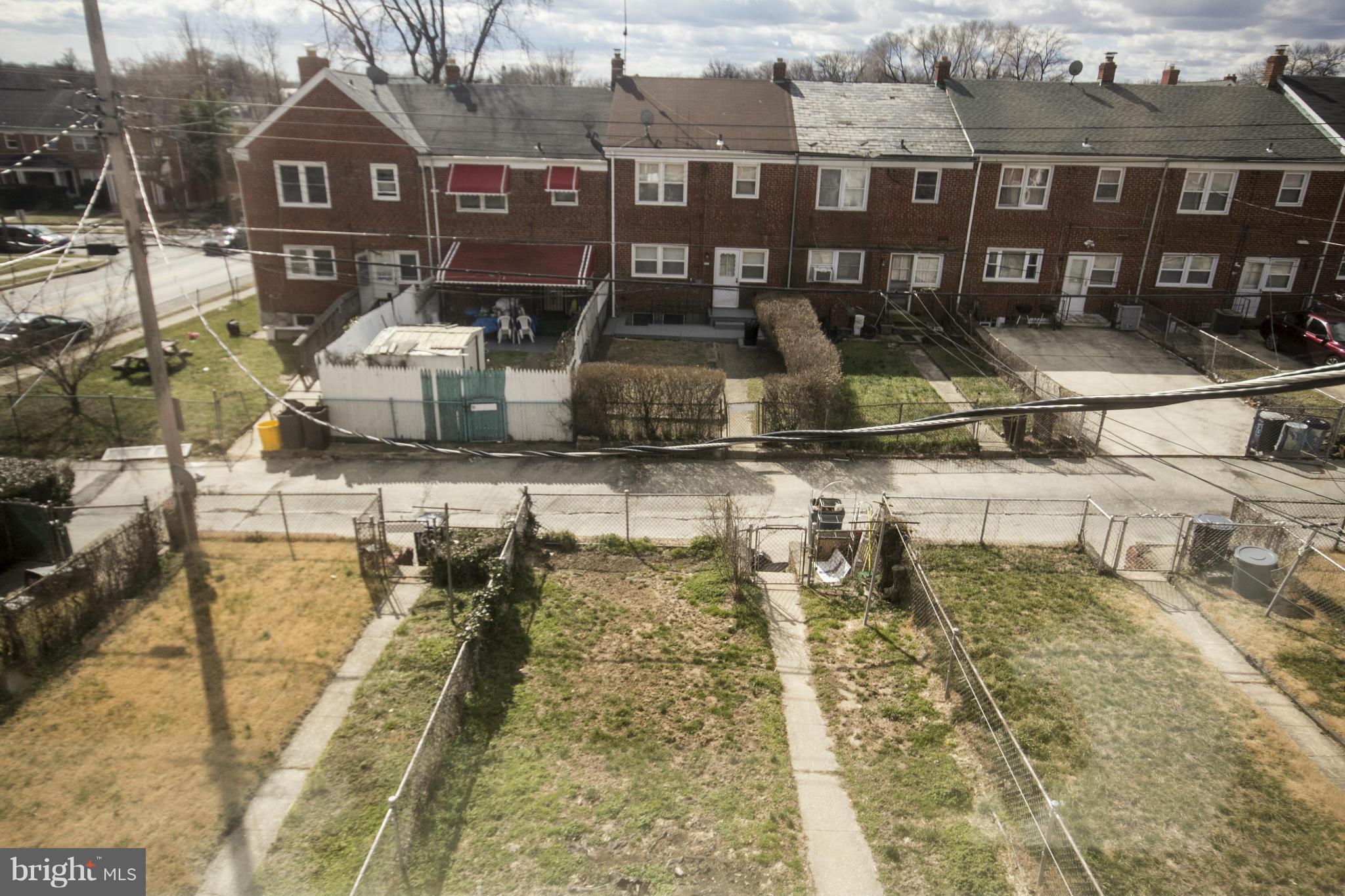 1673 Northbourne Road Baltimore, MD 21239 - Photo 15 of 21 a view of a brick building with many windows