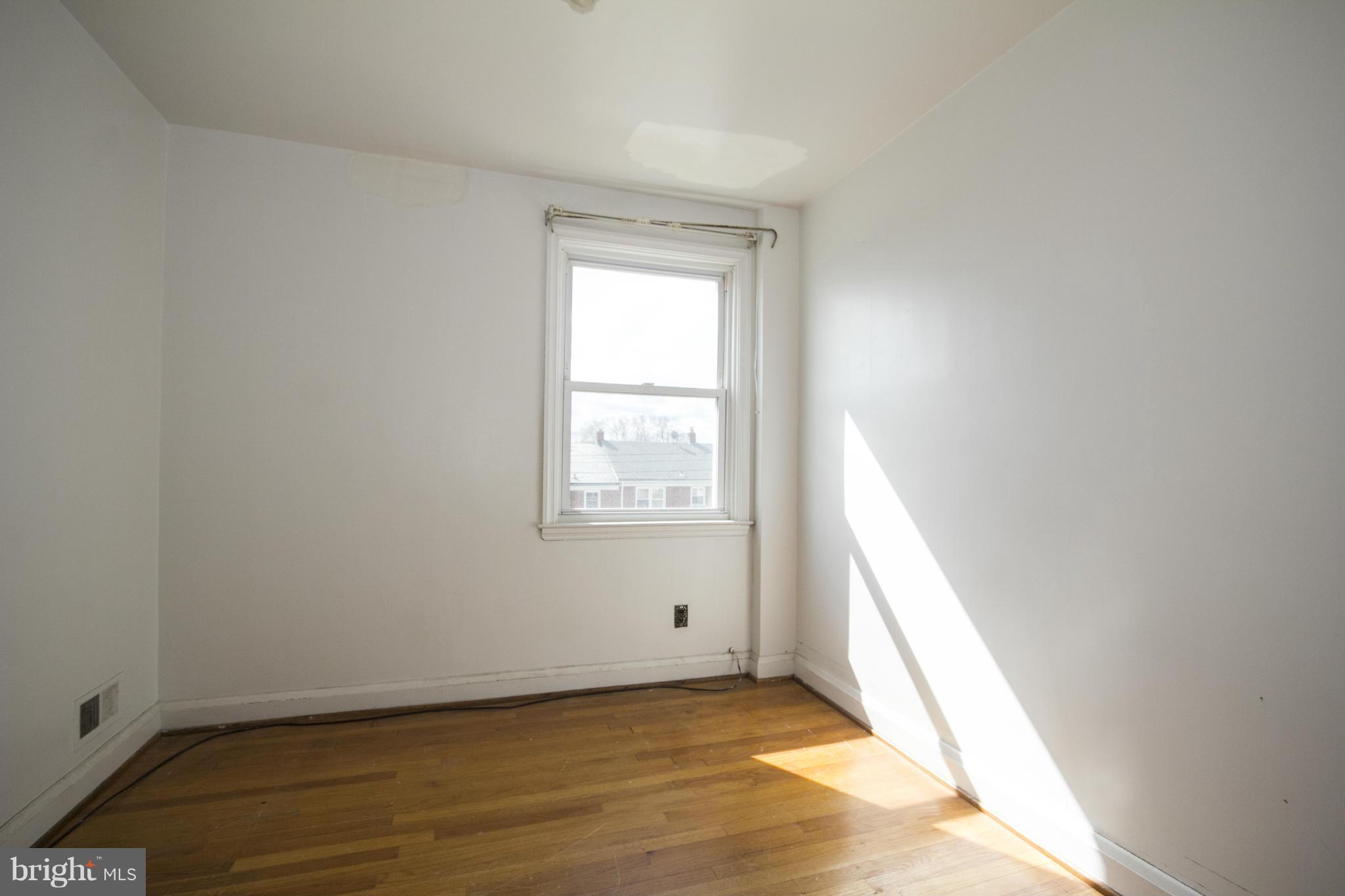 1673 Northbourne Road Baltimore, MD 21239 - Photo 16 of 21 a view of an empty room and window