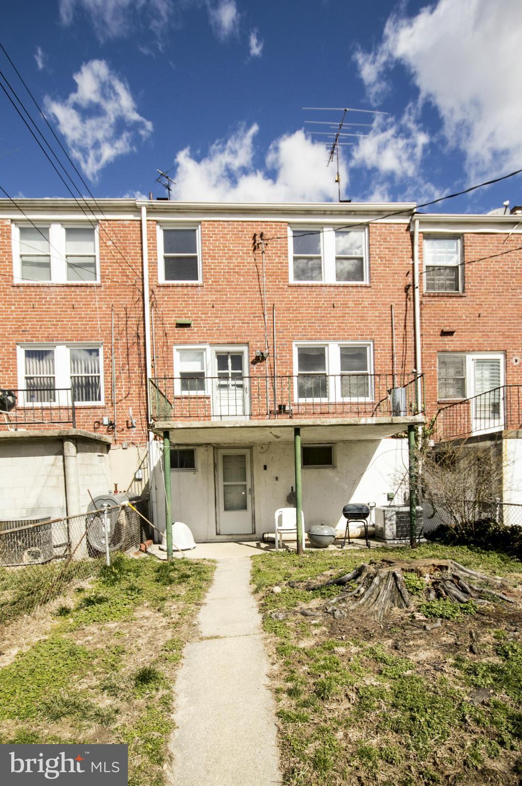 1673 Northbourne Road Baltimore, MD 21239 - Photo 21 of 21 a front view of a house with a yard