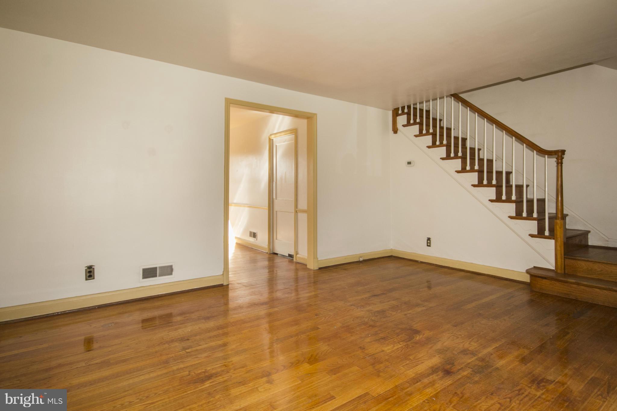 1673 Northbourne Road Baltimore, MD 21239 - Photo 5 of 21 a view of an empty room with stairs and ventilation