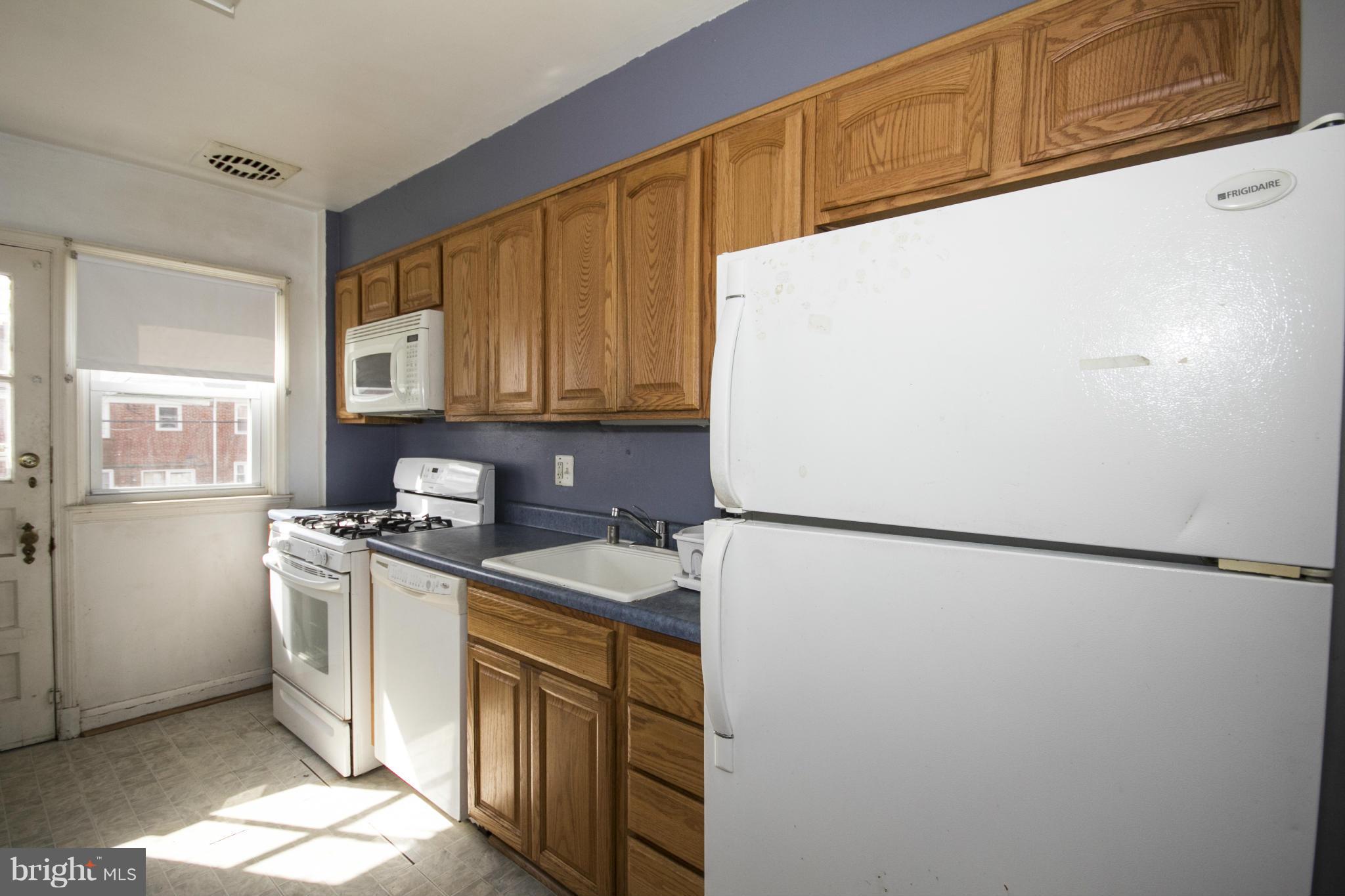 1673 Northbourne Road Baltimore, MD 21239 - Photo 9 of 21 a kitchen with stainless steel appliances a refrigerator and a sink