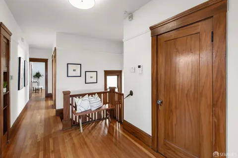 a view of a livingroom with furniture and hardwood floor