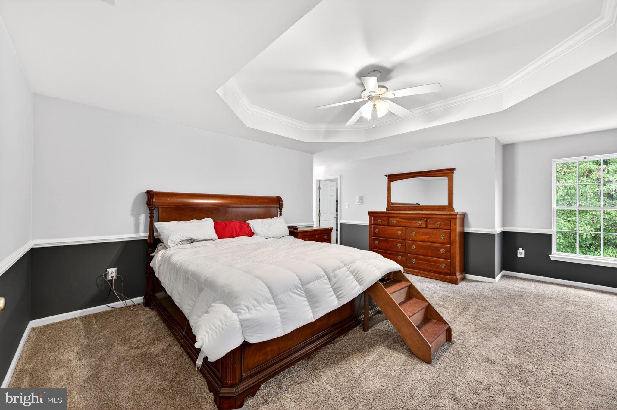 8 North Pointe Terrace Middletown, MD 21769 - Photo 27 of 74 a bedroom with a bed and dresser with mirror