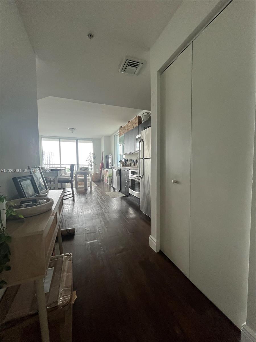 90 Southwest 3rd Street, Unit 1705 Miami, FL 33130 - Photo 12 of 33 a living room with furniture and a table