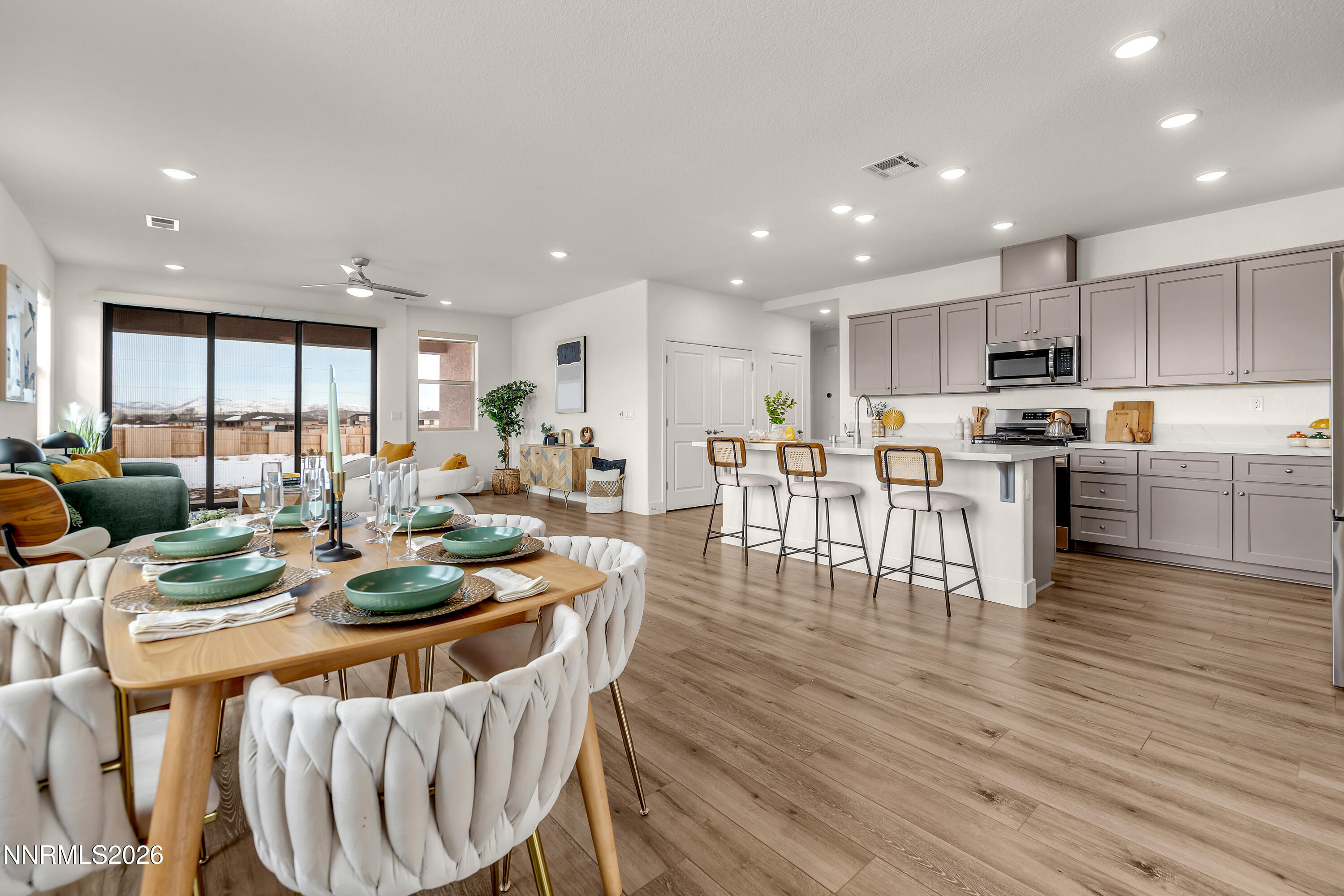 815 North Thunder Butte Court Reno, NV 89506 - Photo 11 of 35 a view of a dining room with furniture a kitchen and chandelier
