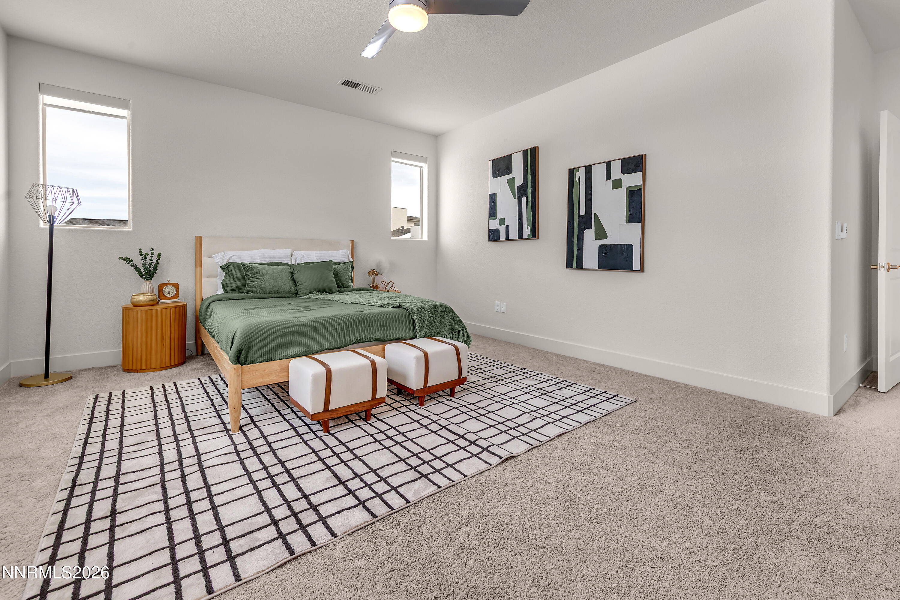 815 North Thunder Butte Court Reno, NV 89506 - Photo 14 of 35 a bedroom with a bed and a couch