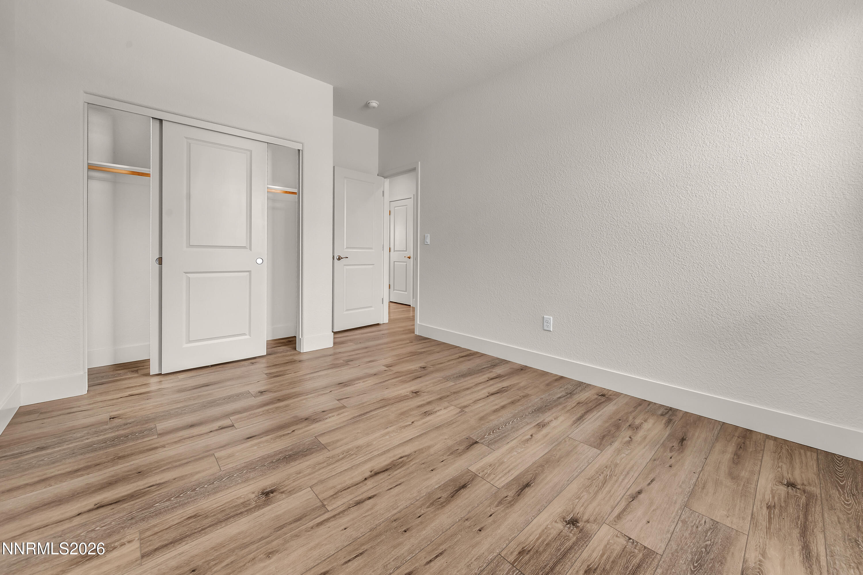 815 North Thunder Butte Court Reno, NV 89506 - Photo 23 of 35 a view of an empty room with wooden floor