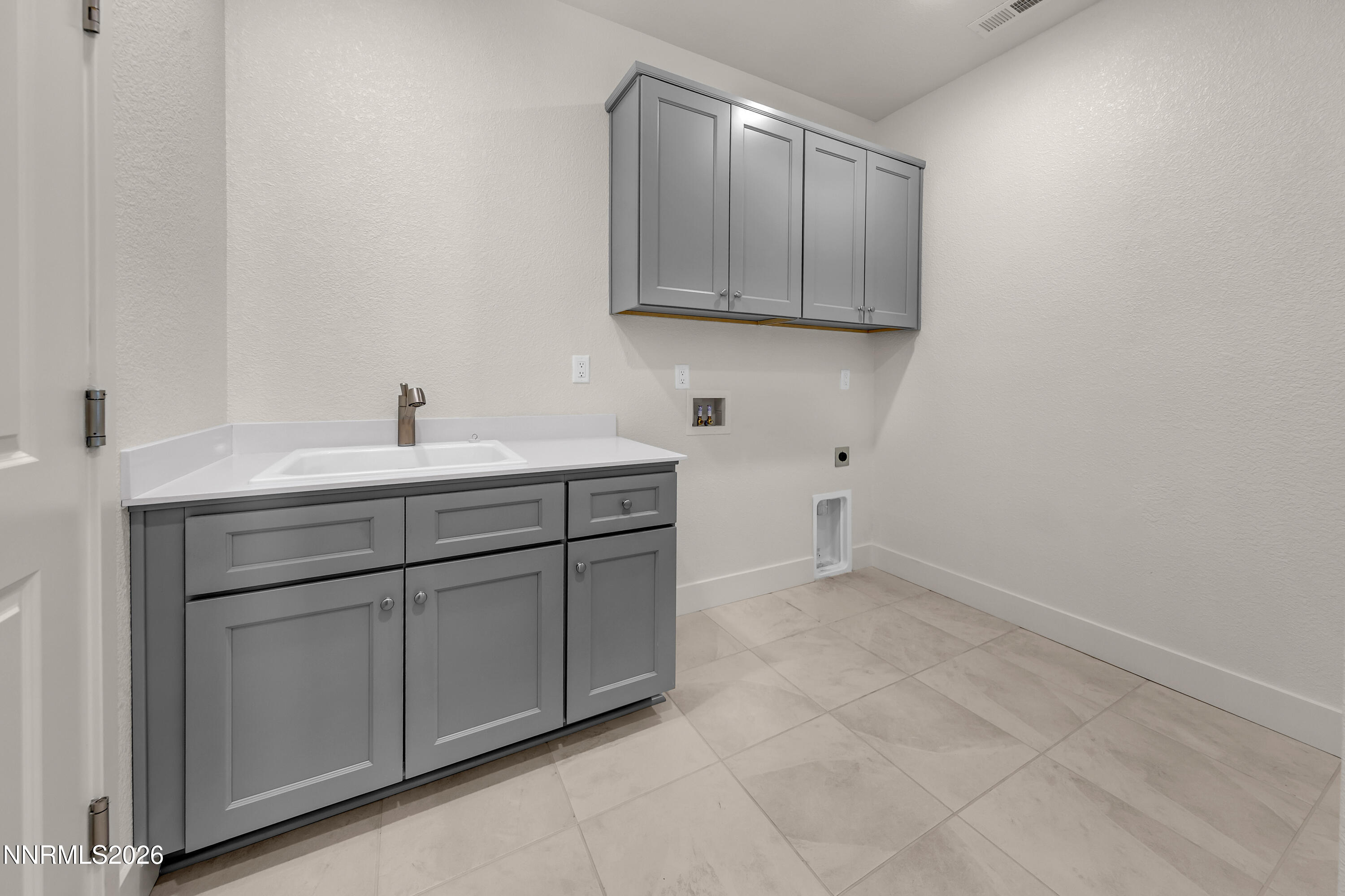 815 North Thunder Butte Court Reno, NV 89506 - Photo 24 of 35 a kitchen with a sink cabinets and utility