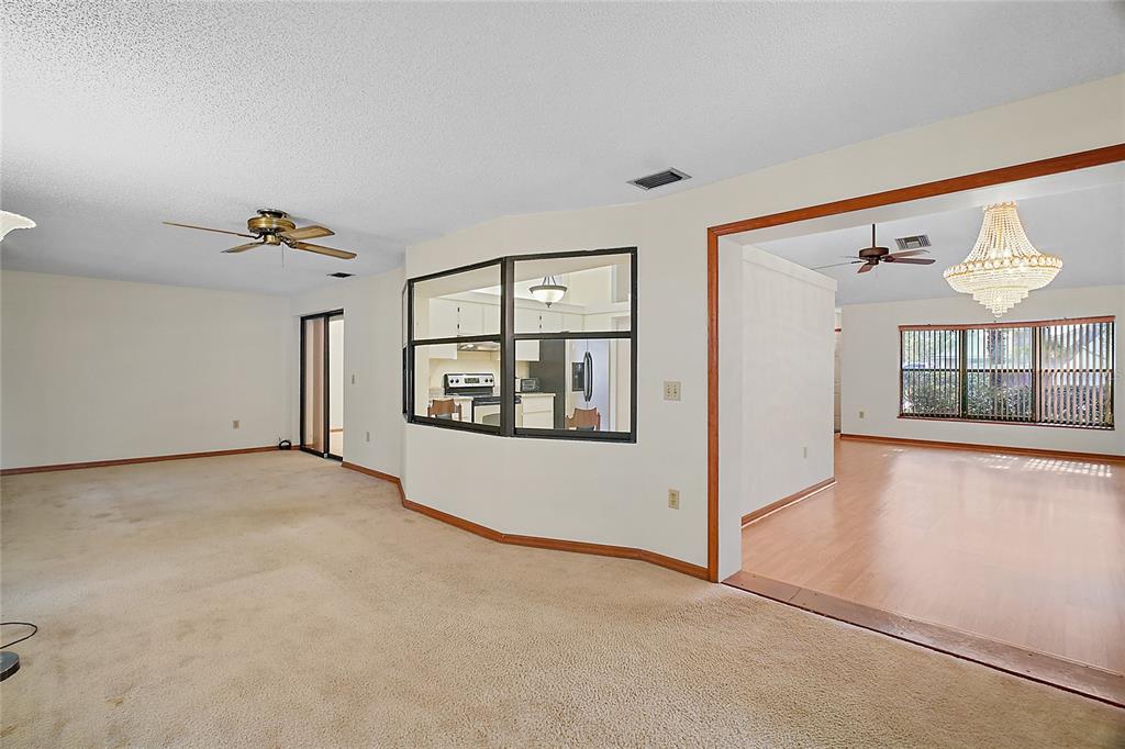 501 Cherry Tree Street Eustis, FL 32726 - Photo 14 of 35 a view of an empty room with a window